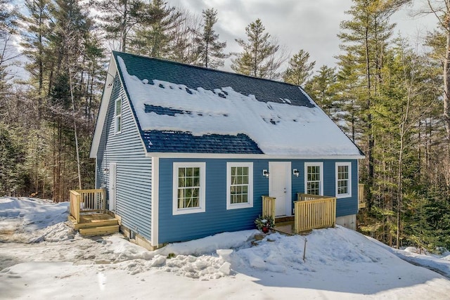 view of front of house with roof with shingles