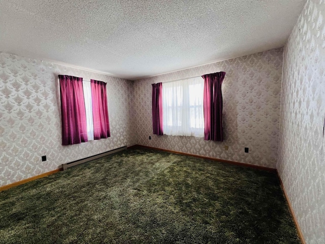 carpeted spare room featuring a textured ceiling, a baseboard radiator, baseboards, and wallpapered walls