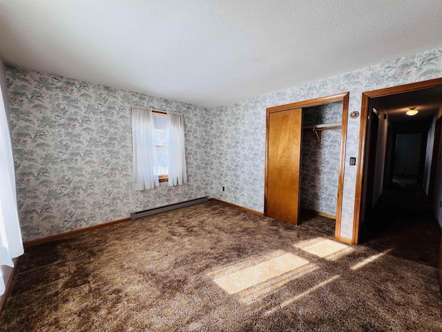 unfurnished bedroom with wallpapered walls, a baseboard radiator, baseboards, and a textured ceiling