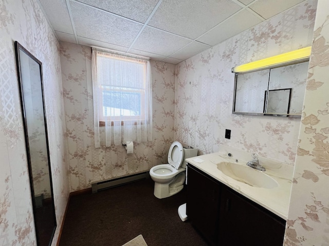 bathroom featuring a baseboard radiator, vanity, a paneled ceiling, and wallpapered walls