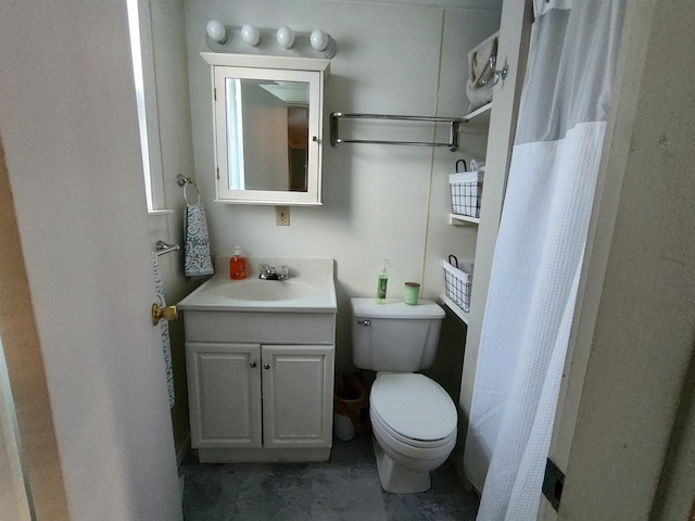 bathroom with toilet, curtained shower, and vanity