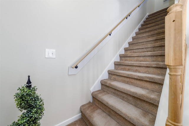 stairs featuring baseboards