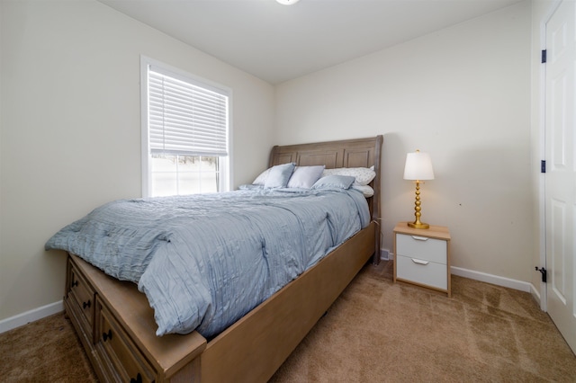 carpeted bedroom with baseboards