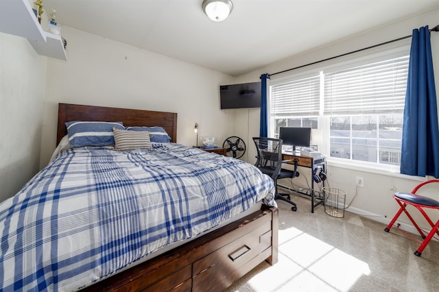 carpeted bedroom featuring baseboards