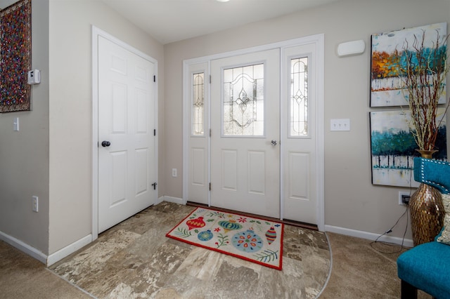 foyer entrance with baseboards