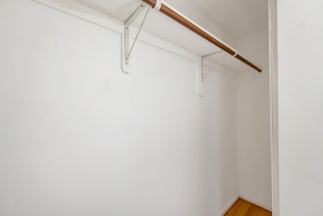 spacious closet with light wood-style flooring