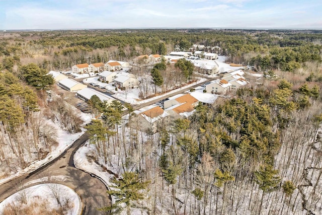 bird's eye view featuring a wooded view