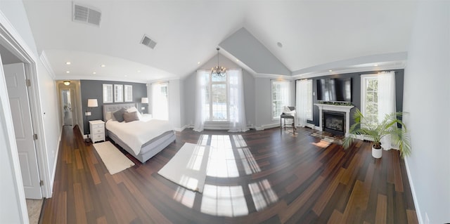 bedroom with a fireplace, visible vents, and multiple windows