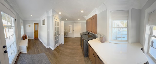 hallway with baseboards, ornamental molding, dark wood-type flooring, french doors, and recessed lighting