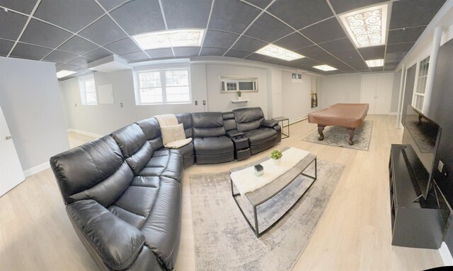 living area featuring a paneled ceiling, pool table, baseboards, and wood finished floors