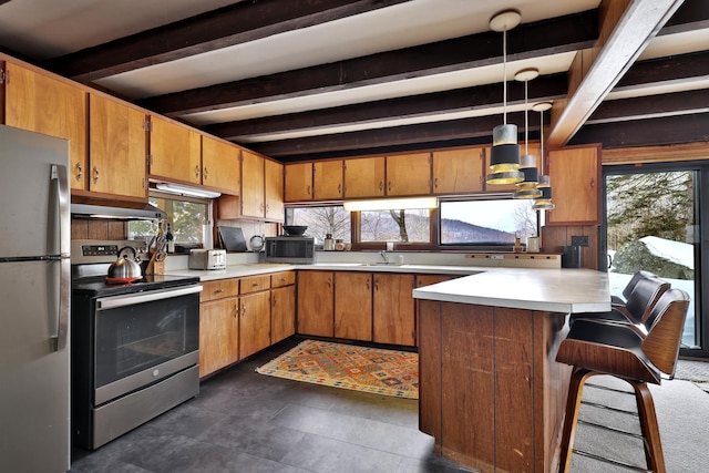 165 Upper Round Top Ext, Plymouth, VT 05056 - kitchen with stainless steel appliances, light countertops, wall chimney range hood, and a peninsula