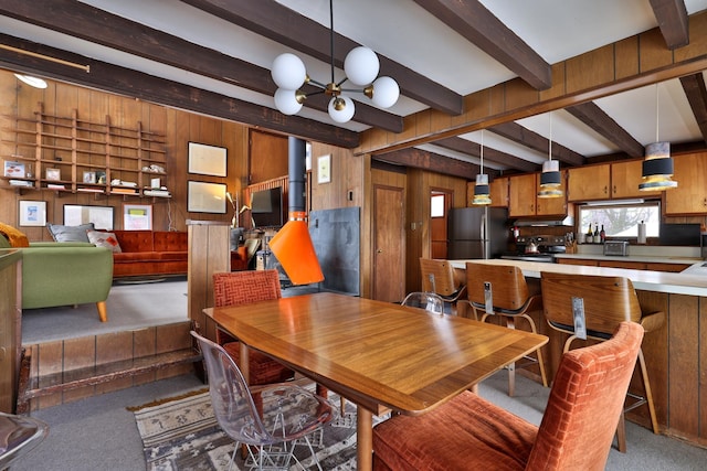 165 Upper Round Top Ext, Plymouth, VT 05056 - carpeted dining room featuring wood walls, a notable chandelier, and beam ceiling