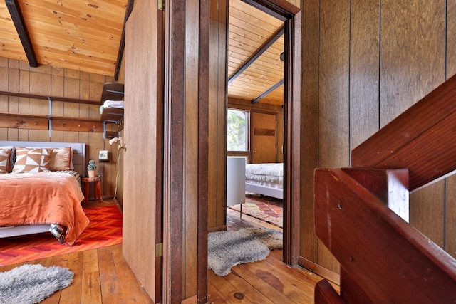165 Upper Round Top Ext, Plymouth, VT 05056 - bedroom with beam ceiling, wooden ceiling, wooden walls, and hardwood / wood-style flooring