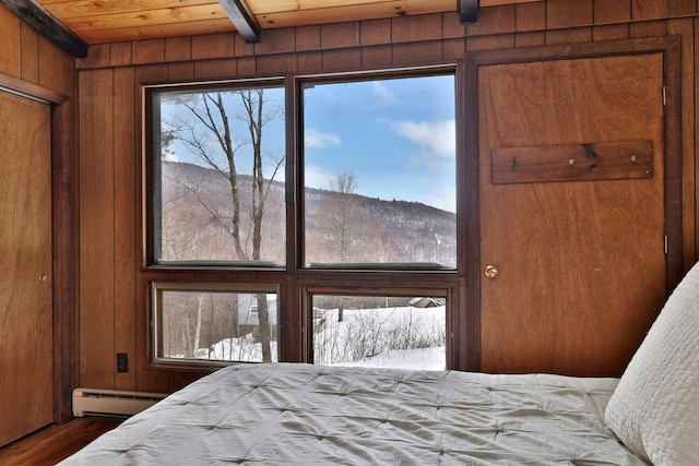 165 Upper Round Top Ext, Plymouth, VT 05056 - bedroom with wooden ceiling, wood walls, wood finished floors, baseboard heating, and beam ceiling