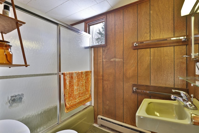 165 Upper Round Top Ext, Plymouth, VT 05056 - bathroom featuring bath / shower combo with glass door, a baseboard radiator, a sink, and toilet