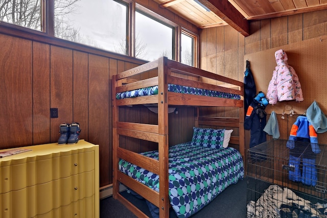 165 Upper Round Top Ext, Plymouth, VT 05056 - bedroom with beamed ceiling, wooden walls, and baseboard heating