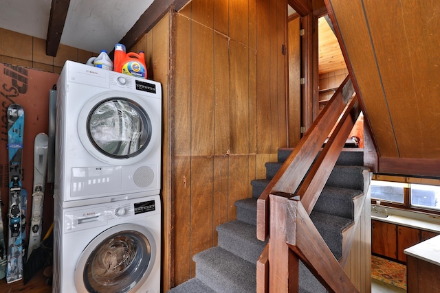 165 Upper Round Top Ext, Plymouth, VT 05056 - laundry room featuring laundry area, wooden walls, and stacked washer and clothes dryer