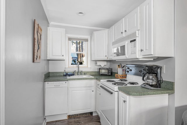 kitchen with white appliances, a toaster, white cabinets, dark wood-style floors, and a sink