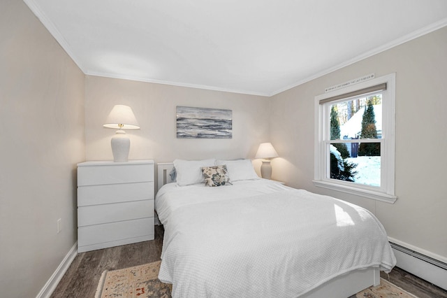 bedroom with baseboards, a baseboard radiator, wood finished floors, and crown molding