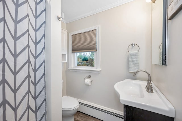 bathroom with toilet, a shower with curtain, ornamental molding, baseboard heating, and vanity