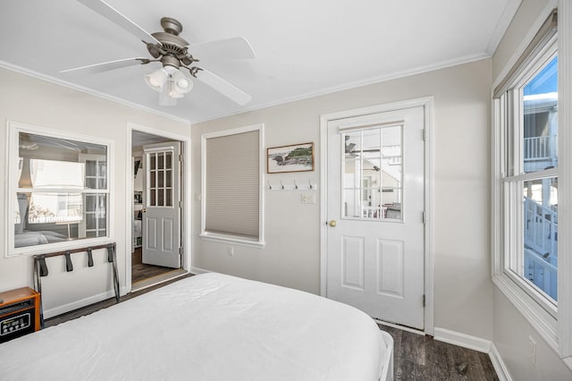 bedroom with ornamental molding, dark wood finished floors, baseboards, and ceiling fan