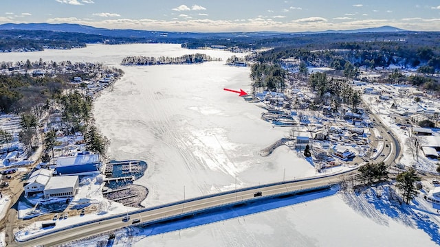 snowy aerial view with a mountain view