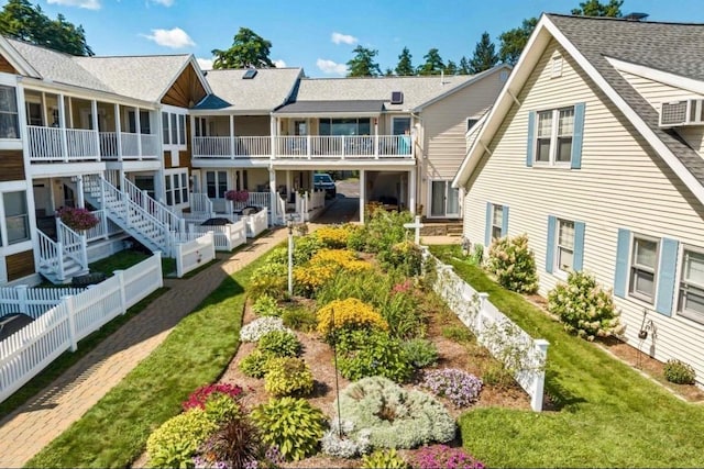 exterior space with fence and a yard