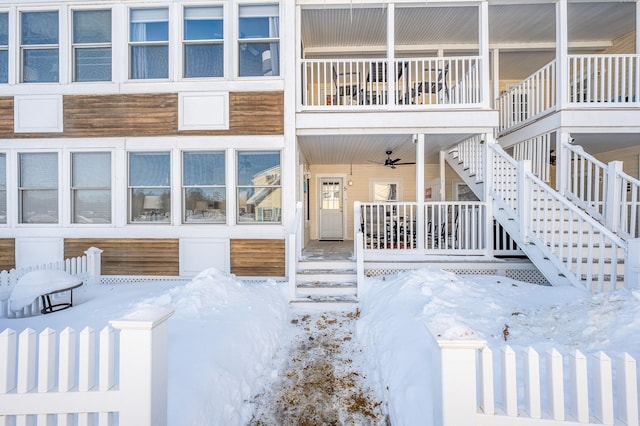 view of snow covered property entrance