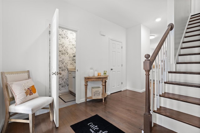 entrance foyer with recessed lighting, stairway, baseboards, and wood finished floors