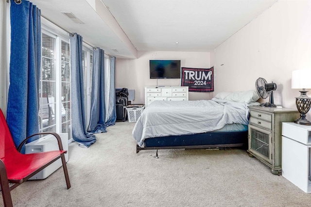 bedroom with carpet floors and visible vents