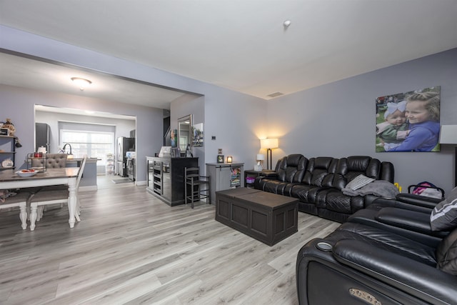 living area with light wood-style floors