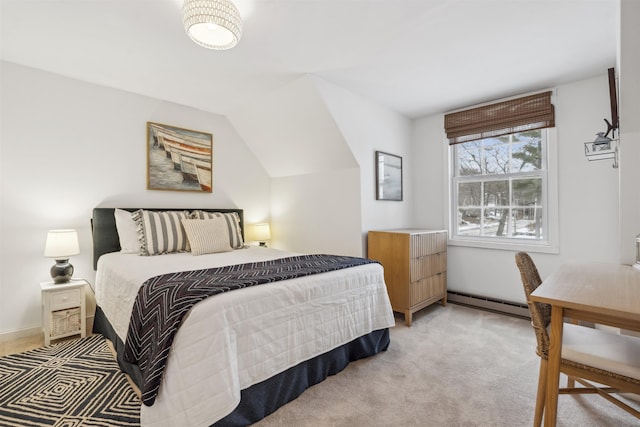 bedroom featuring lofted ceiling, baseboard heating, and light colored carpet