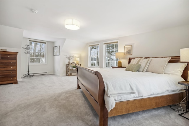 bedroom with carpet floors and baseboard heating