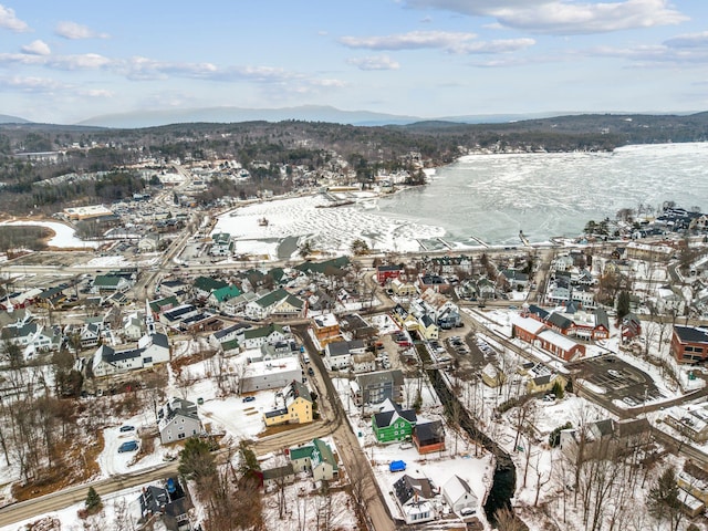 snowy aerial view with a mountain view