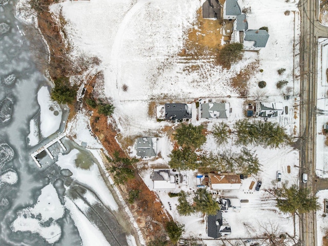 snowy aerial view with a residential view