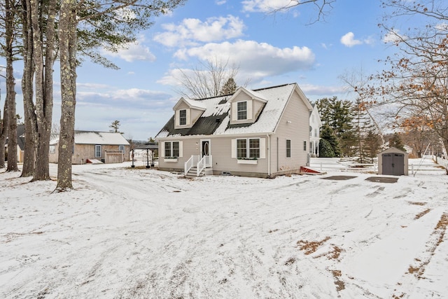 view of front of house featuring a garage, a storage unit, and an outdoor structure