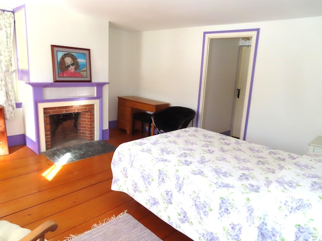 bedroom with a fireplace with flush hearth