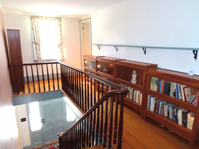 stairway featuring wood finished floors