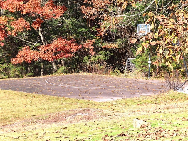 view of yard featuring community basketball court