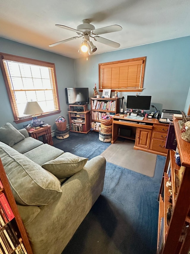 office featuring a ceiling fan and carpet flooring