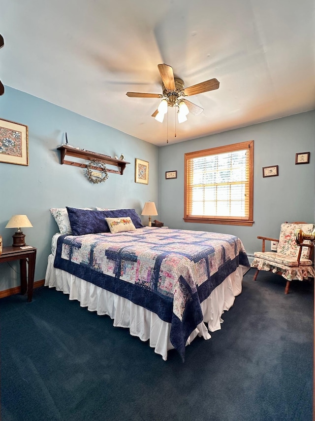 carpeted bedroom featuring a ceiling fan and baseboards