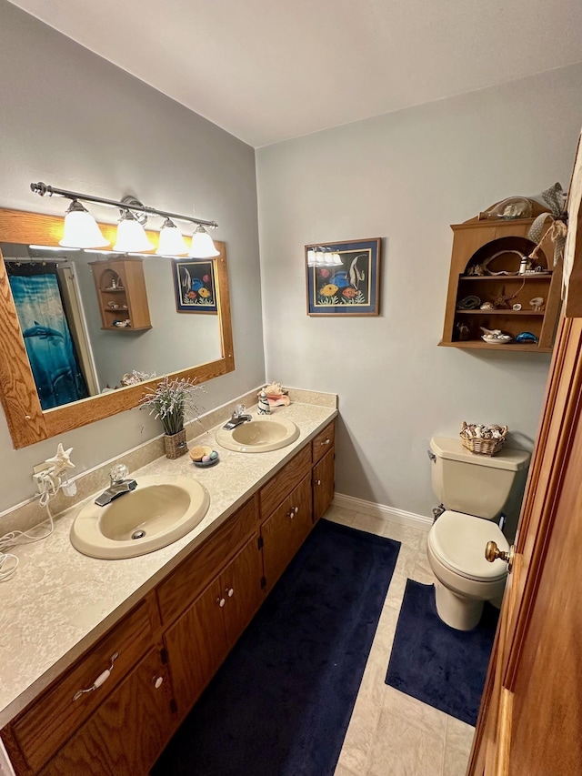 full bathroom featuring tile patterned flooring, a sink, toilet, and double vanity