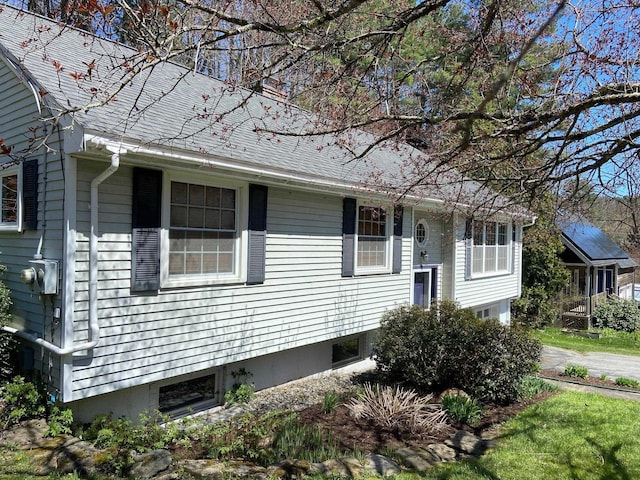 view of front of house with roof with shingles