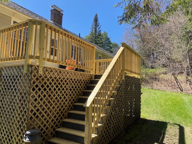 exterior space with stairway and a lawn