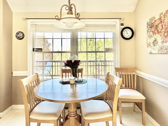 dining room featuring baseboards