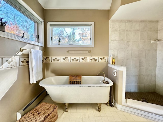 full bath featuring a baseboard radiator, a tile shower, a freestanding bath, and tile patterned floors