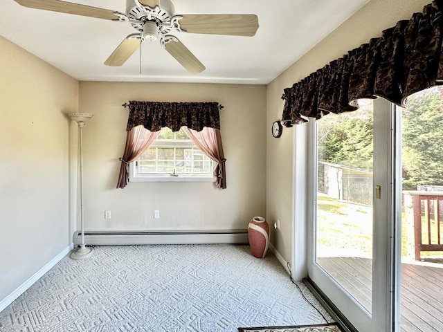 spare room with baseboards, baseboard heating, a ceiling fan, and light colored carpet