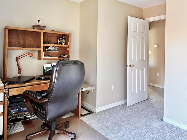 office area featuring baseboards and carpet flooring