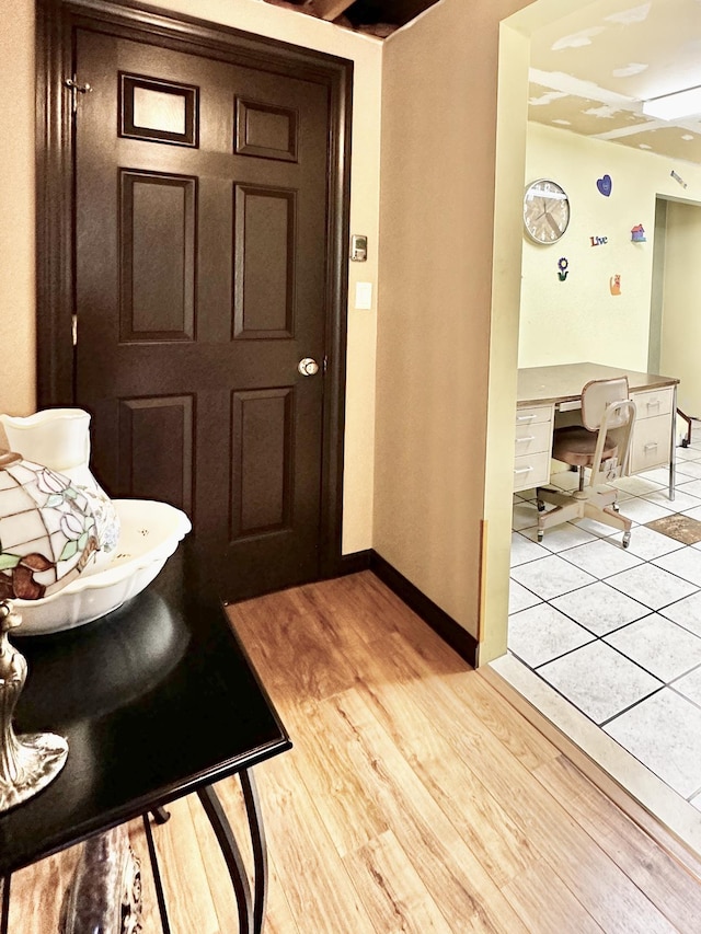 interior space with light wood-style floors and baseboards