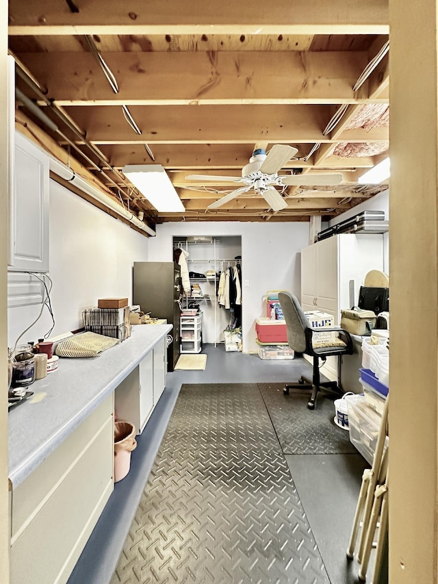 unfinished basement featuring ceiling fan